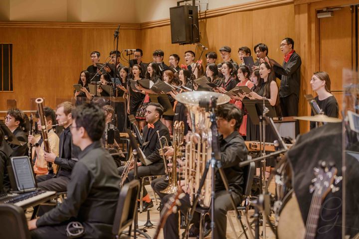 The GG Orchestra and choir performing together on stage